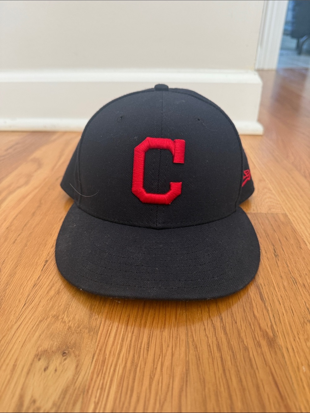 New Era Black Baseball Cap with Red 'C' Logo